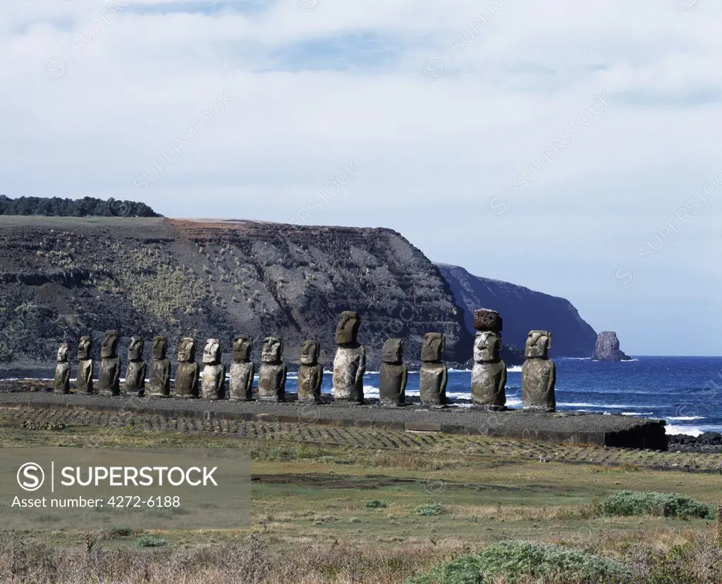 Fifteen colossal stone statues or moais stand on their platform, Ahu Tongariki, on the eastern coast of the island with their backs to the ocean and the cliffs of the Poike Peninsula behind.   At over 200m in length, Tongariki is the largest platform on Easter Island.  The statues are up to 10 metres tall.