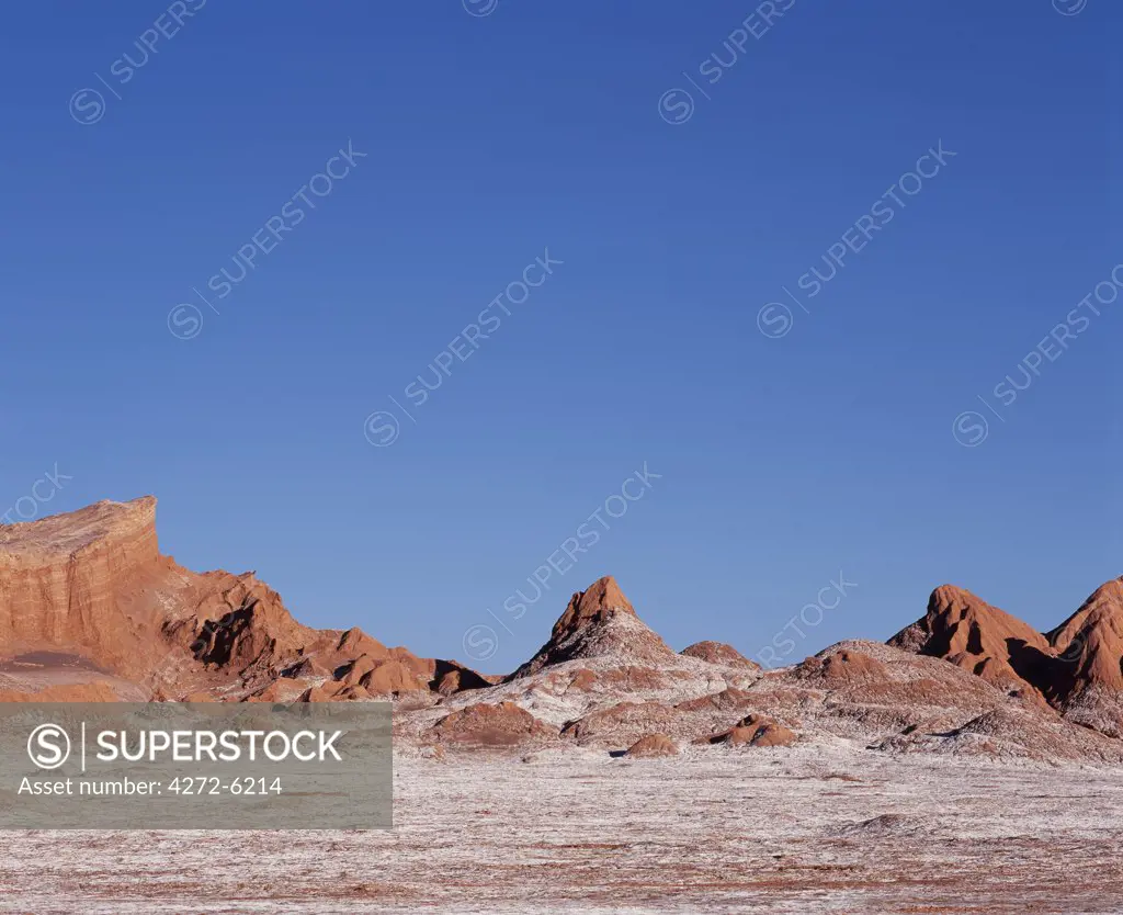 The striking landscape of Moon Valley near to San Pedro de Atacama in the Atacama Desert is characterised by wind-eroded hills and mineral crusted valley floor.