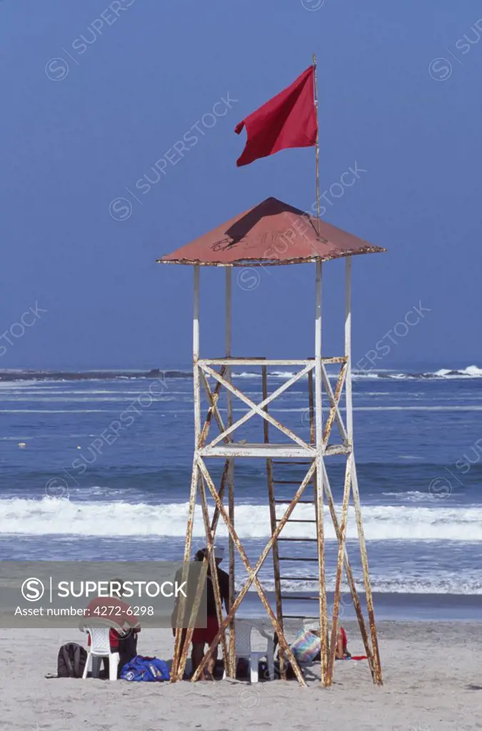 Lifeguards on Playa Cavancha, the most central of Iquique's city beaches.  Situated on the Pacific coast at the foot of the 800-metre coastal cordillera, Iquique is the capital of Region 1.  During the nitrate boom in the 19th century Iquique became Chile's richest city.