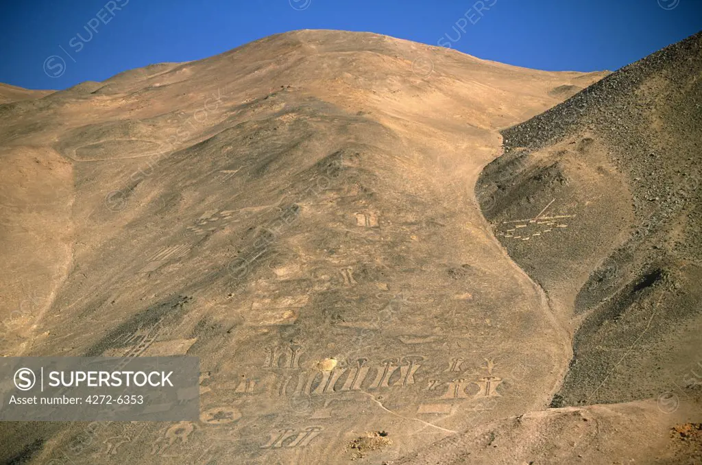 Chile, Region I, Pintados. Geoglyphs on a mountainside near Pintados, Northern Chile- representations of humans, animals, and geometric designs