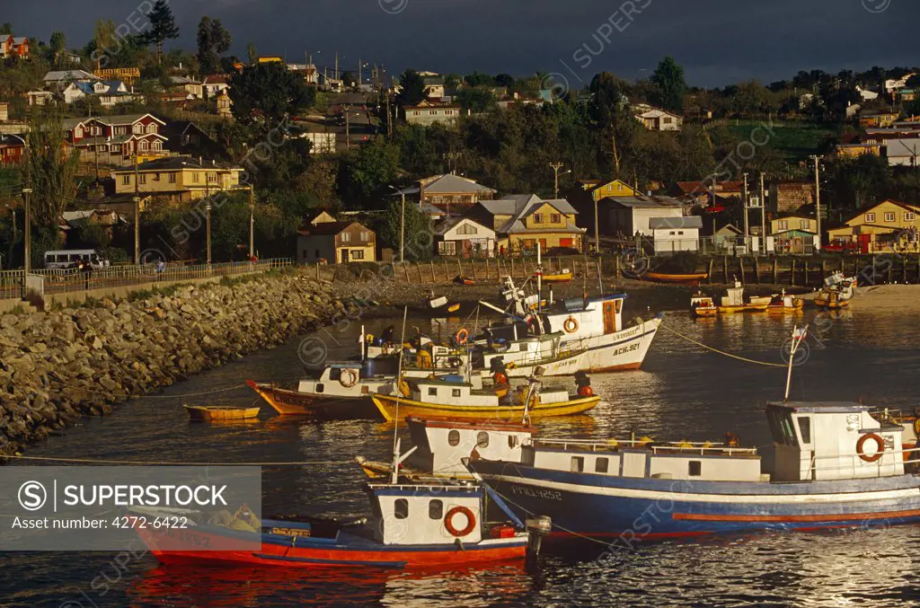 Chile, Puerto Montt, Calbuco. Fishing boats in the port harbour of Calbuco, Puerto Montt, Region X, Southern Chile.