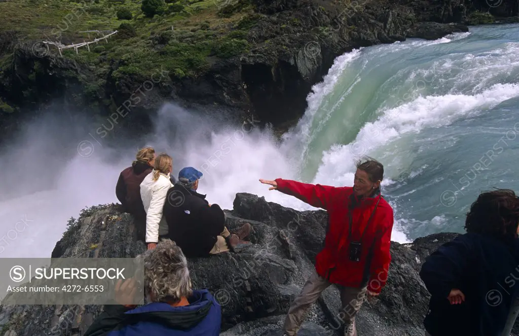 Chile, Torres del Paine National Park. Tourists at Salto Grande waterfall.