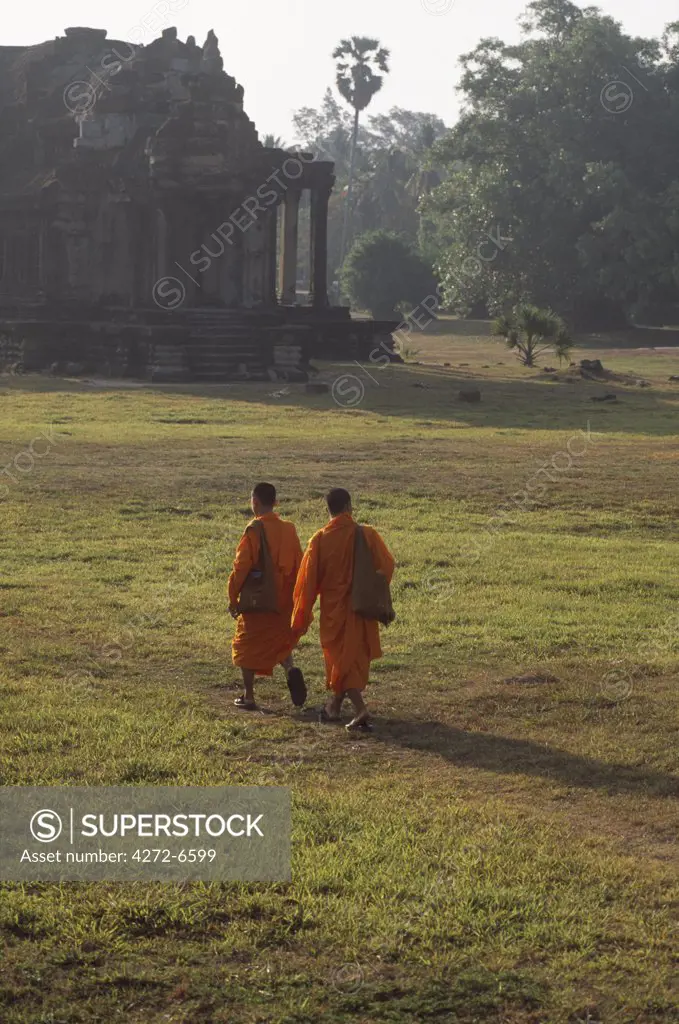 Buddhist priests in basin near Western entrance walking towards Central Sanctuary