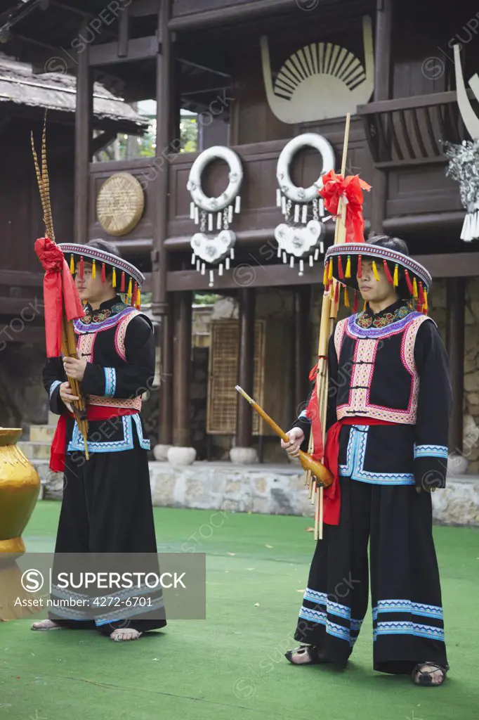 Men dressed in traditional clothing of Yao minority at Folk Culture Village, Shenzhen, Guangdong, China
