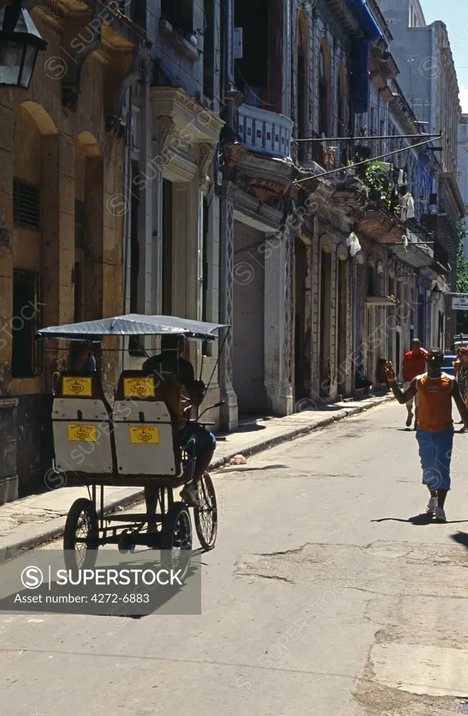 Bicycle taxi in back street of Havana Viejo, Old Havana World Heritage Area, Cuba