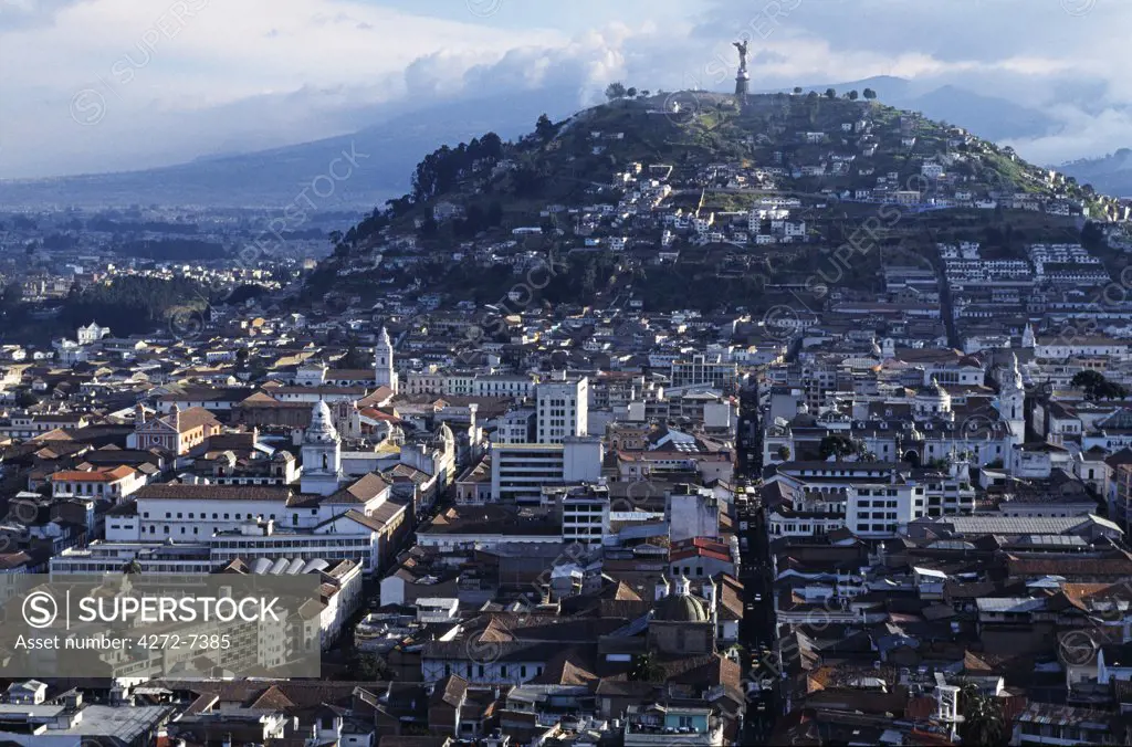 View over downtown Quito, capital city of Ecuador. The city centre contains many fine examples of Spanish colonial architecture and is a UNESCO World Heritage site. A 41m statue of the Virgin of Quito, completed in 1976, stands atop the hill known as El Panacillo (the little bread roll).