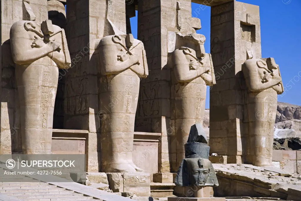Headless statues of Ramses II line the courtyard at the entrance to the Ramesseum, Luxor.