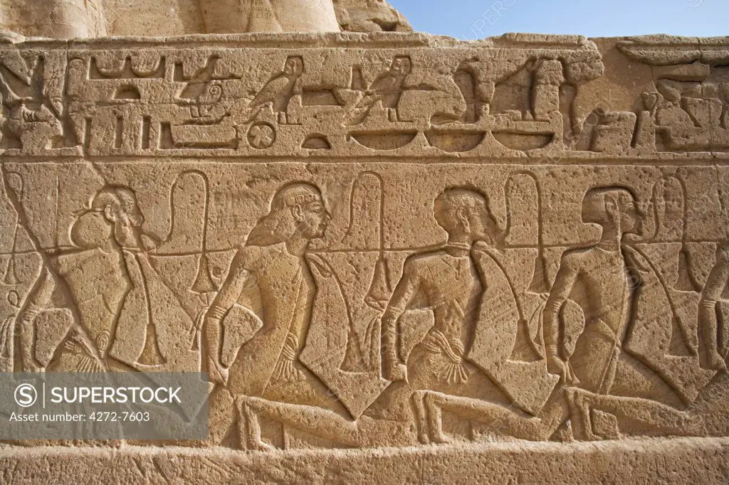 Carvings depict prisoners captured in battle by Ramses II at Abu Simbel. The entire site was moved 200m in the 1960s in order to save it from the rising waters of Lake Nasser.