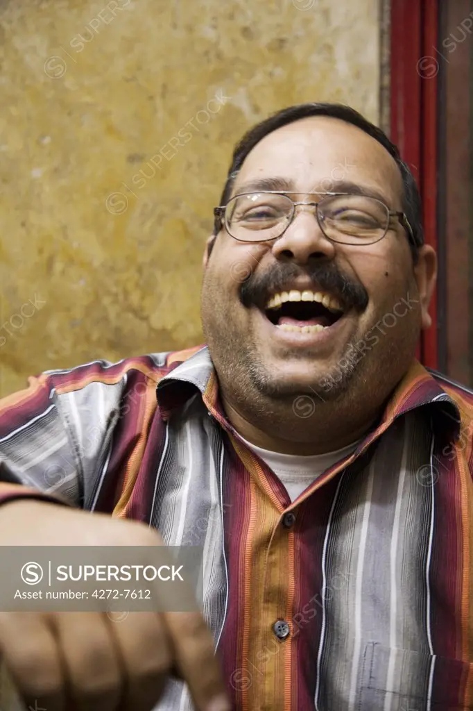 A jeweller in Khan el-Khalili enjoys a joke, Cairo, Egypt.