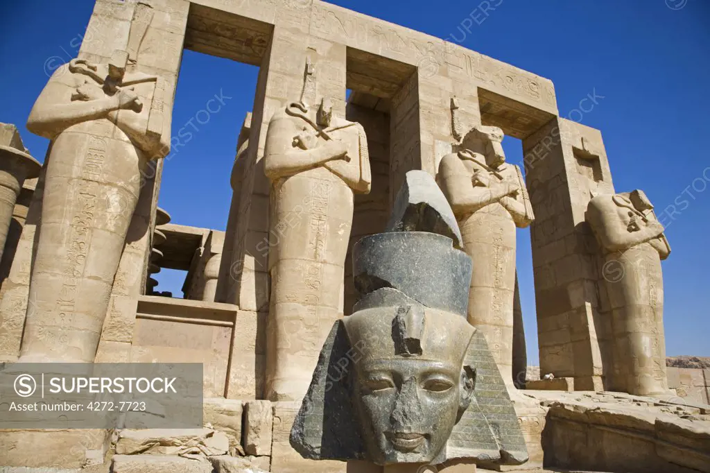 Headless statues of Ramses II line the courtyard at the entrance to the Ramesseum, Luxor, Egypt.