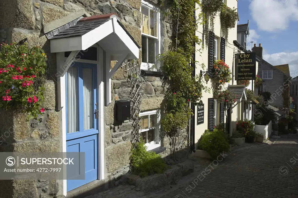 A street in the Fisherman's Quarter of St Ives, Cornwall, lined with B&Bs and hotels. Once the home of one of the largest fishing fleets in Britain, the industry has since gone into decline. Tourism is now the primary industry of this popular seaside resort town.