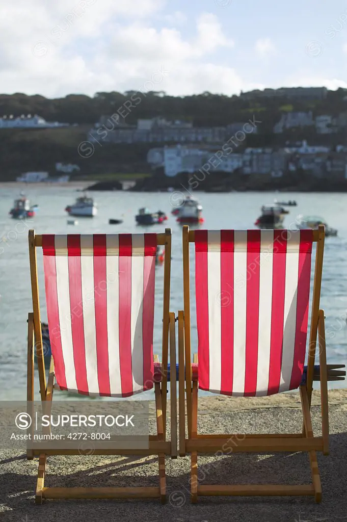 Deckchairs, the symbol of British tourism, on the quayside of St Ives, Cornwall.