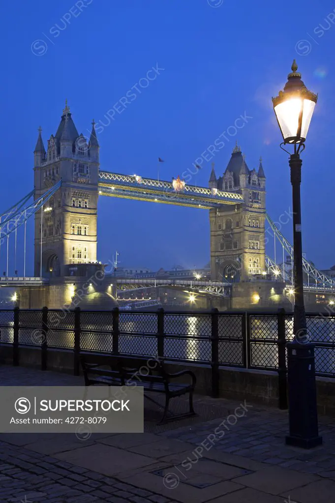 Tower Bridge by night. Construction of the bridge started in 1886 and took 8 years. The central span can be raised to allow ships to travel upriver. The bridge is close to the Tower of London, which gives it its name. It is often mistaken for London Bridge, the next bridge upstream