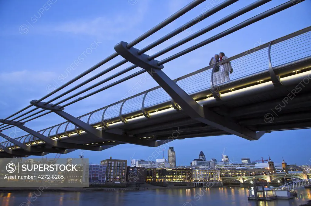 A couple take in the view from the Millennium Bridge.