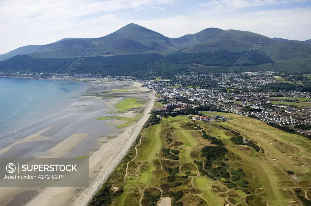 The Royal County Down golf course with the Slieve Donard Hotel, the small coastal town of Newcastle and the Mountains of Mourne behind.
