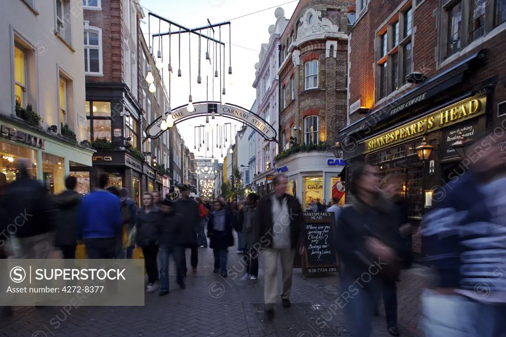 Christmas shoppers enjoy the lights in Carnaby Street