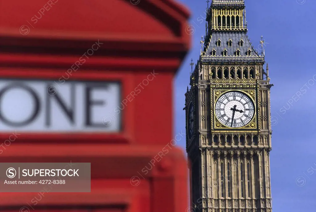 London's famous Clock Tower, Big Ben, is viewed from behind another English icon - the red phone booth. Big Ben's name actually comes from the 13 tonne bell hanging inside the tower and named after its commissioner, Benjamin Hall