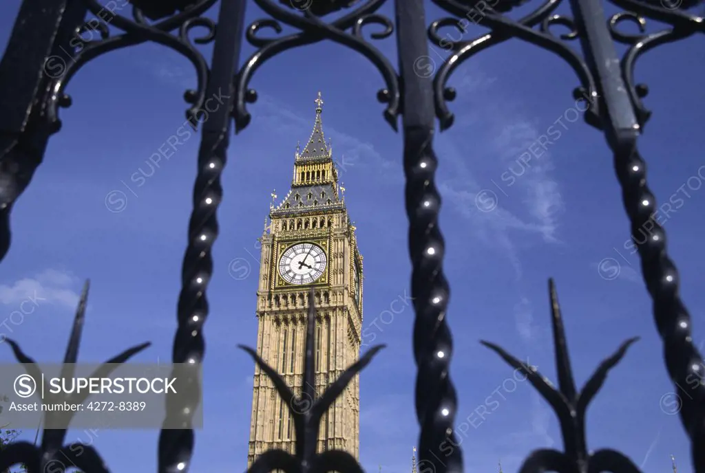 London's famous Clock Tower, Big Ben, is framed by the gates of the Palace of Westminster. Big Ben's name actually comes from the 13 tonne bell hanging inside the tower and named after its commissioner, Benjamin Hall