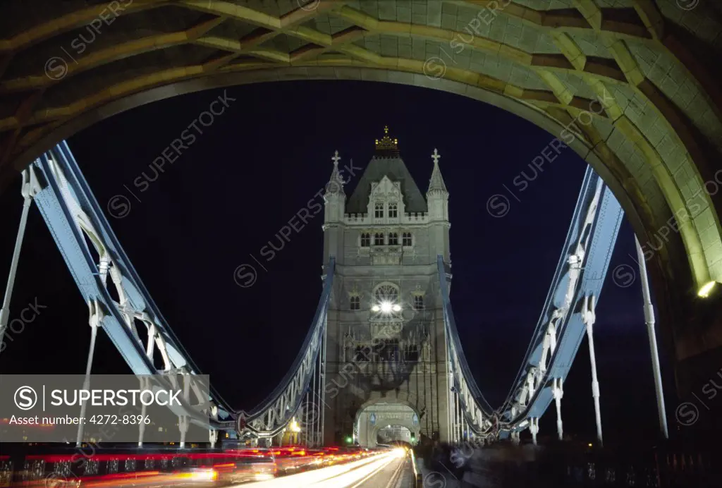 Traffic and pedestrians cross Tower Bridge in central London. Built in 1894, the iconic bridge was designed to rise and allow ship to pass through.
