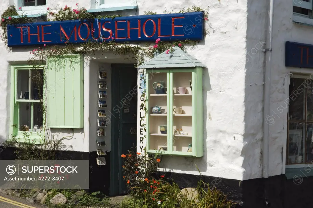 A crafts shop sells curios to tourists at the old fishing village of Mousehole, Cornwall, England