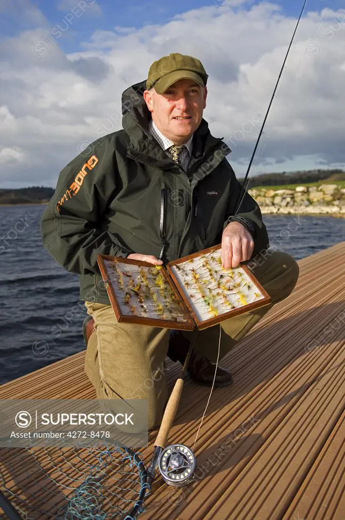 UK, Northern Ireland, Fermanagh. A fisherman fly fishing on Lough Erne (MR).