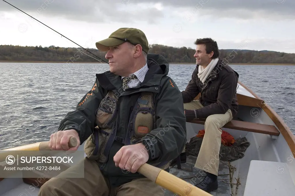 UK, Northern Ireland, Fermanagh. Fly fishing for trout from a boat on Lough Erne (MR).