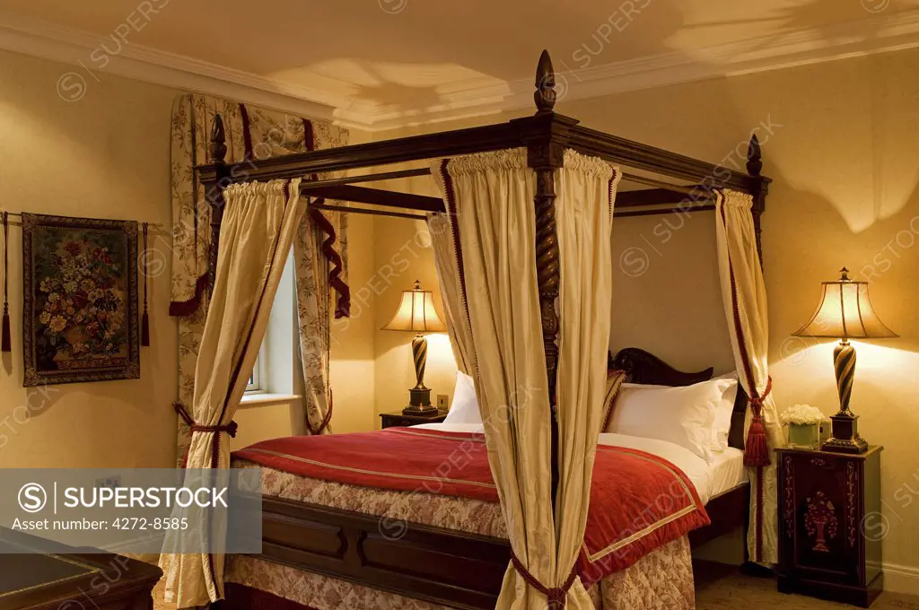 Northern Ireland, Fermanagh, Enniskillen. Four-poster bed in The Nick Faldo Suite at Lough Erne Golf Resort.