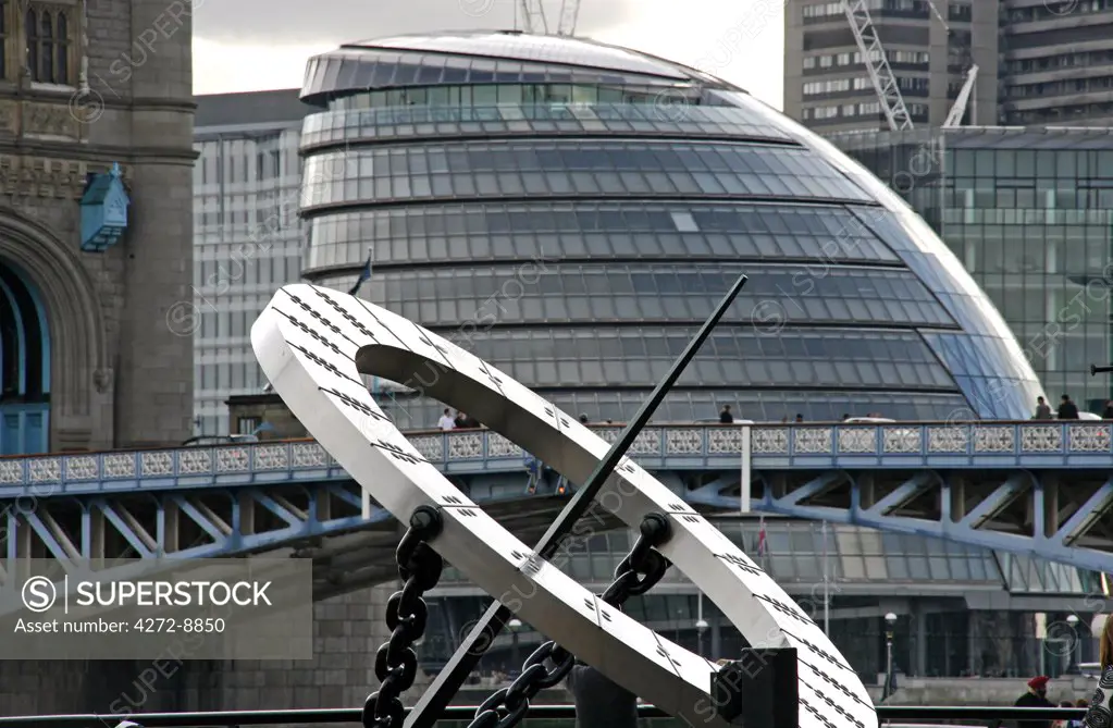 England, London. City Hall designed by architect Norman Foster with a sundial at St Katherine's Dock in the foreground.