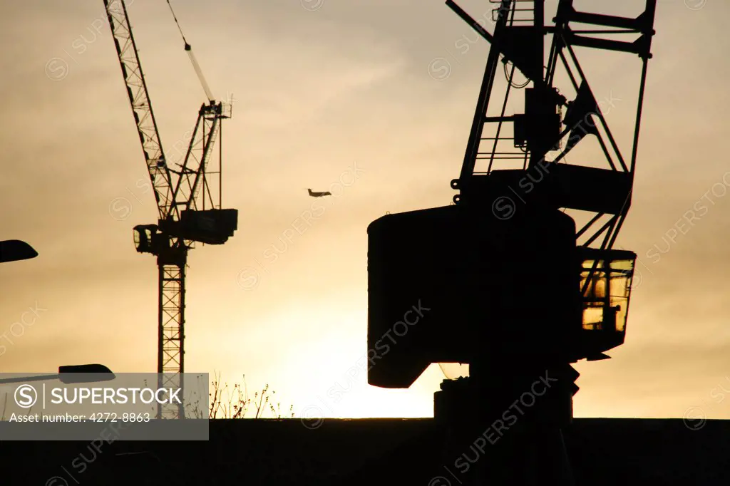 England, London. Cranes in Canary Wharf.