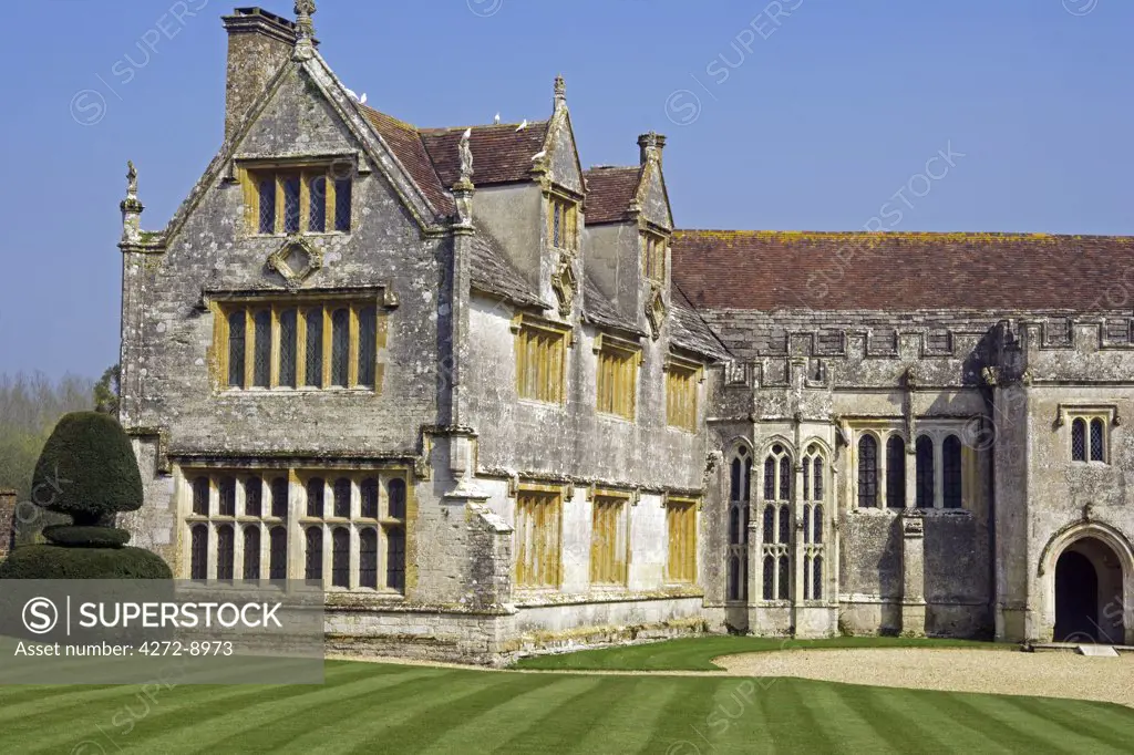 England, Dorset. Athelhampton is one of the finest examples of 15th century manor houses in England. Medieval in style predominantly and surrounded by walls, water features and secluded courts.
