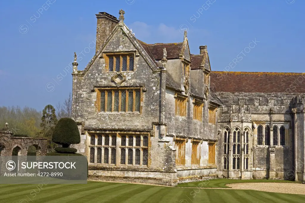 England, Dorset. Athelhampton House is one of the finest examples of 15th century domestic architecture in the country. Medieval in style predominantly and surrounded by walls, water features and secluded courts.