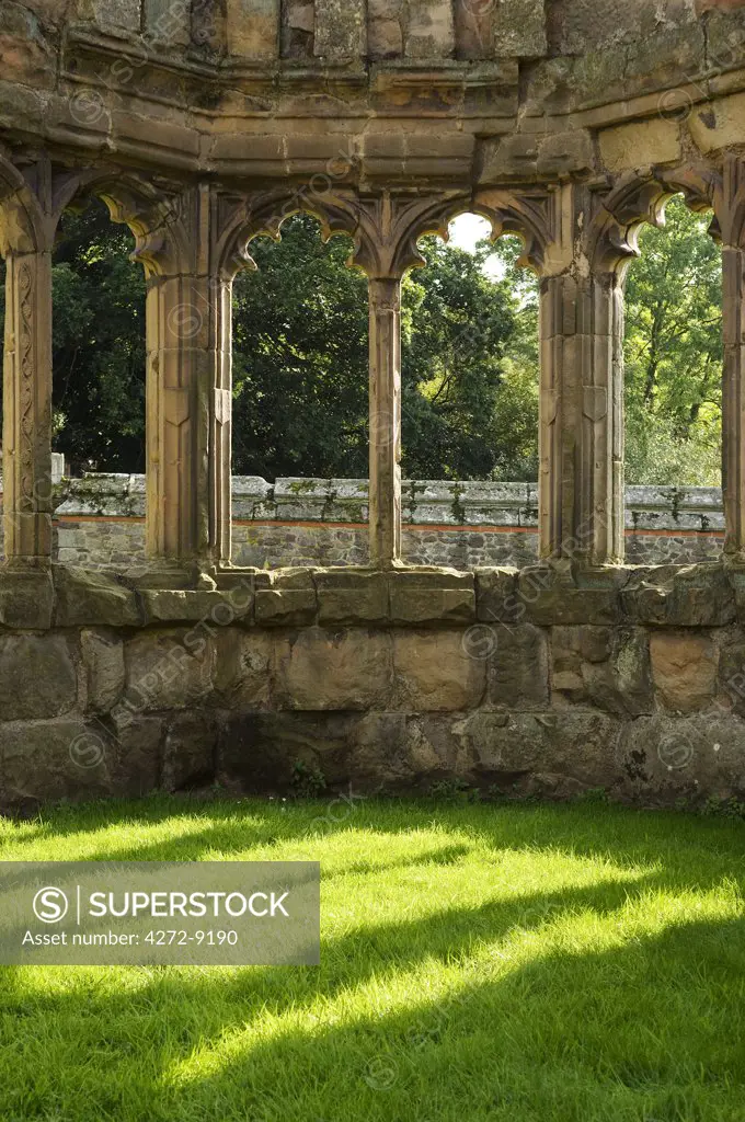 England, Shropshire, Shrewsbury. The ornate carved stone columns of a bay window in the Abbot's Hall of Haughmond Abbey, a 12th Century Augistinian abbey near Shrewbury.