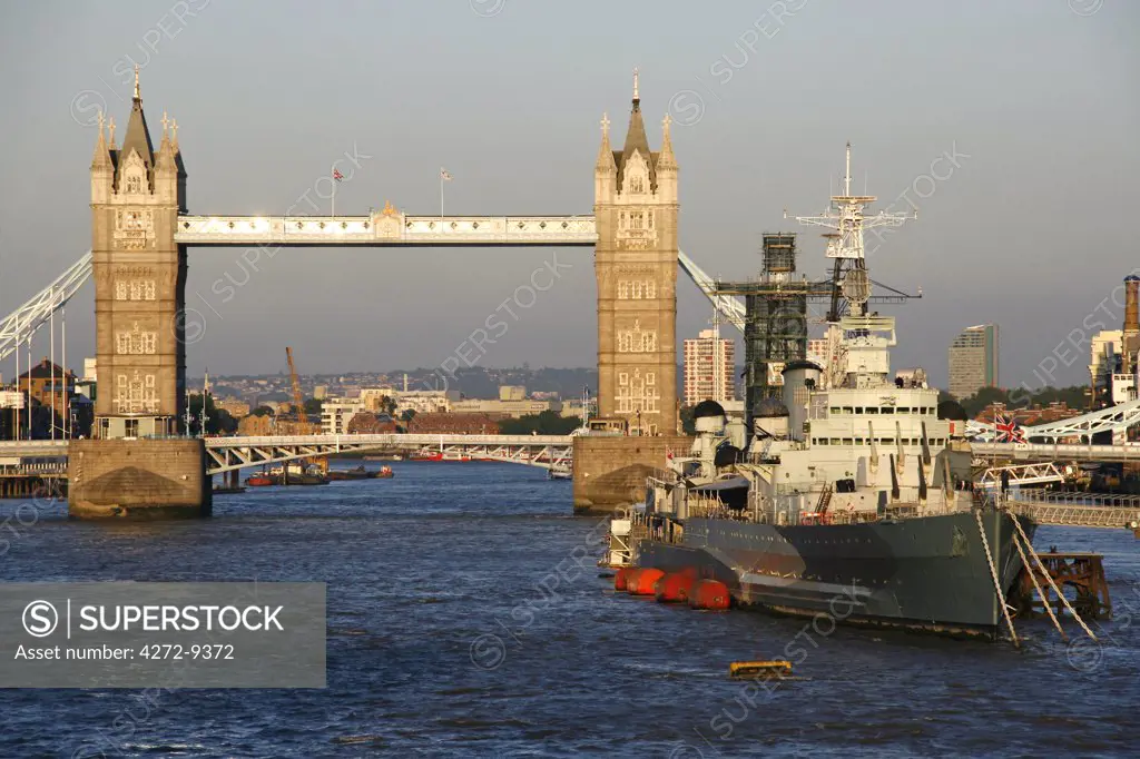 England, London. London Tower Bridge with HMS Belfast in the foreground.