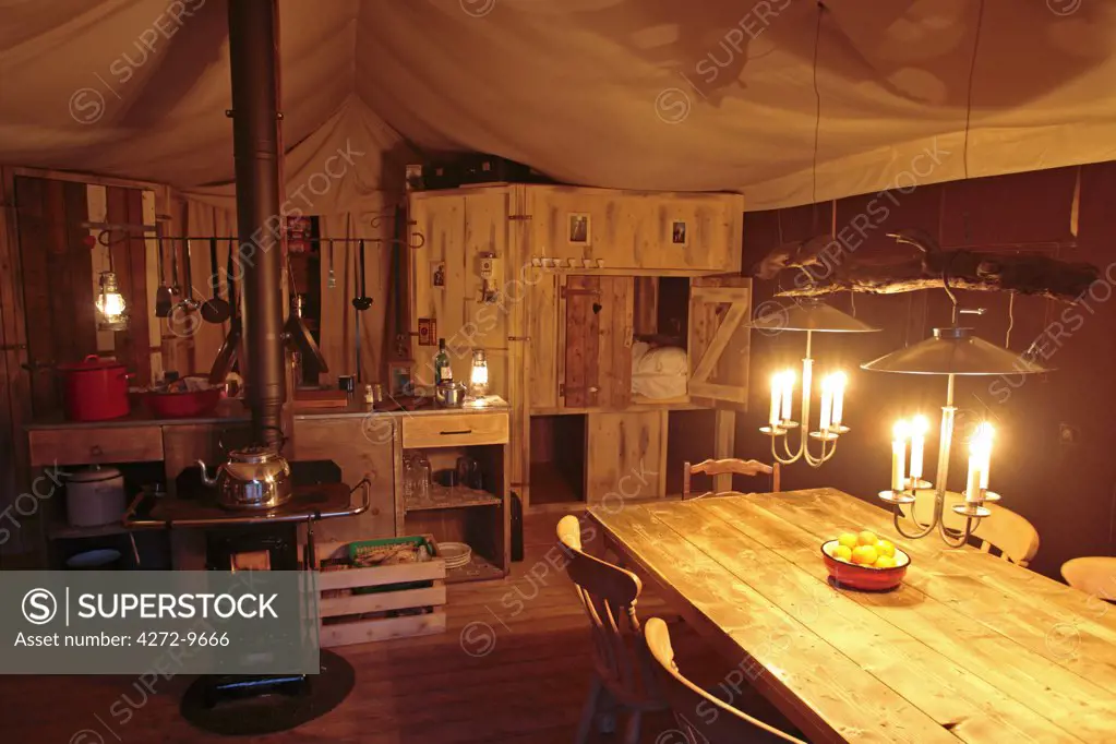 England, Lake District. Interior of a Feather Down Farm tent at night.