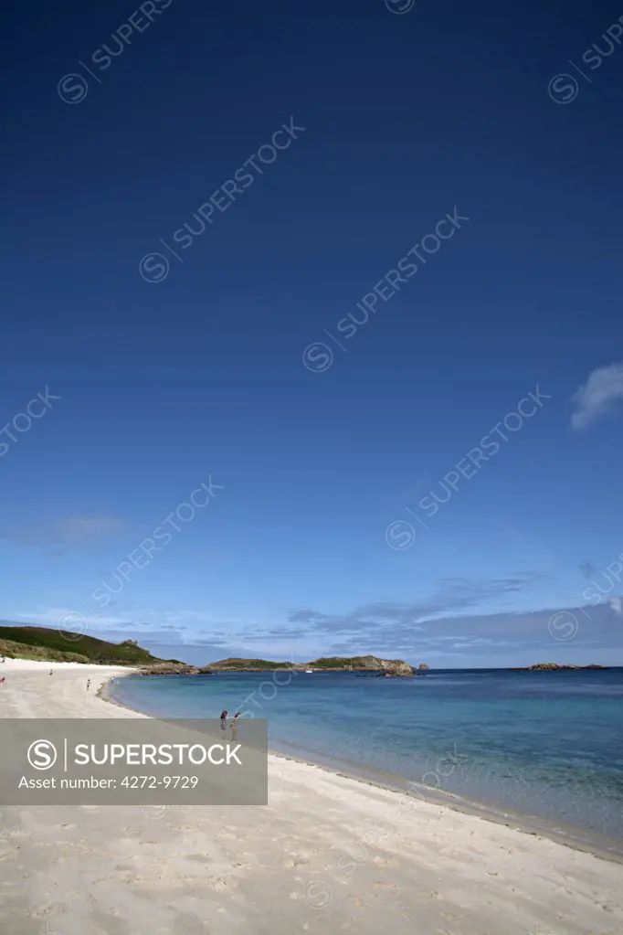 England, Isles of Scilly, St Martin's. Children paddling in the shallows at Great Bay.