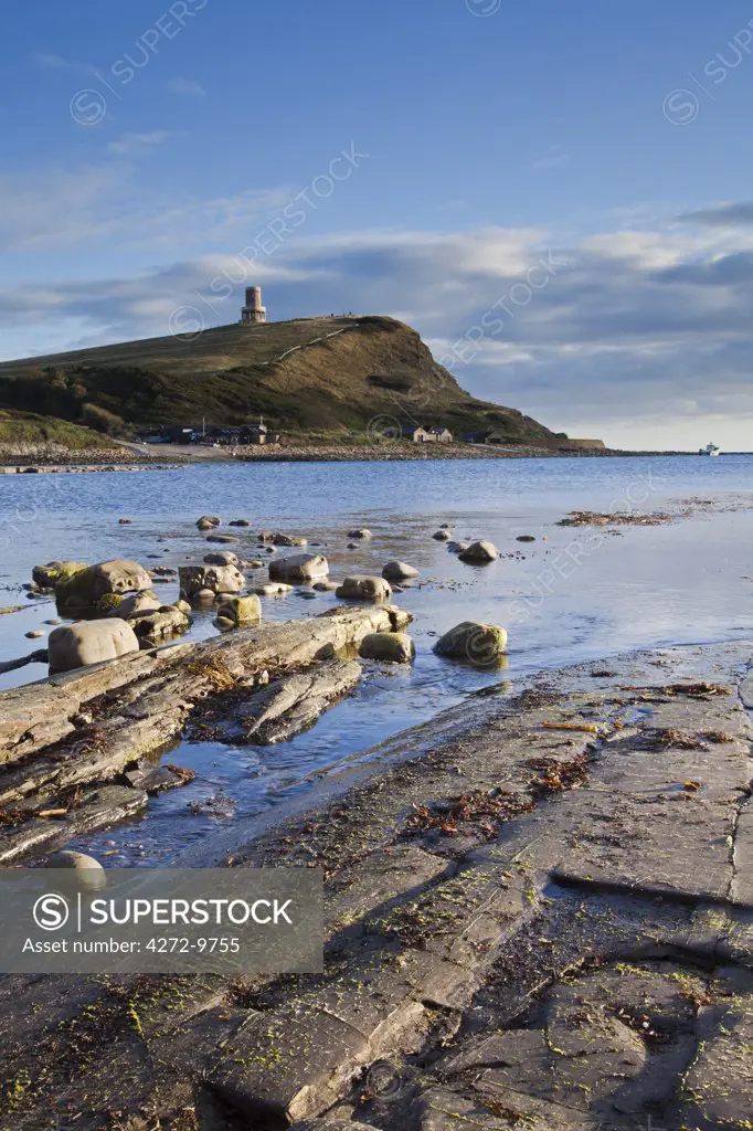 England, Dorset, Kimmeridge Bay.  The rocks at Kimmeridge Bay were formed in the Jurassic period, 155 million years ago.  Looking towards Clavell Tower, owned by the Landmark Trust.