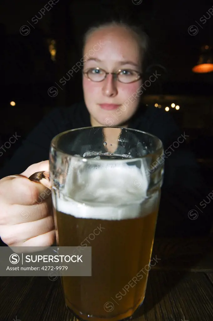 Student drinking beer in a tavern in Tallinn