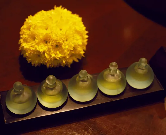 Bottles of scented oils in the spa of the Chedi Hotel