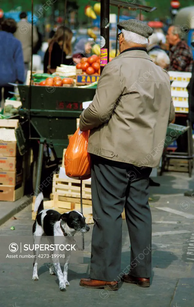 Senior Man at the Market with his Dog