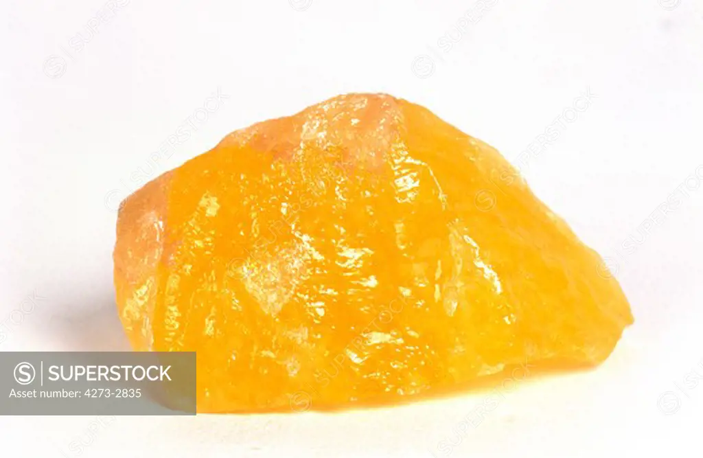 Orange Calcite Stone Against White Background