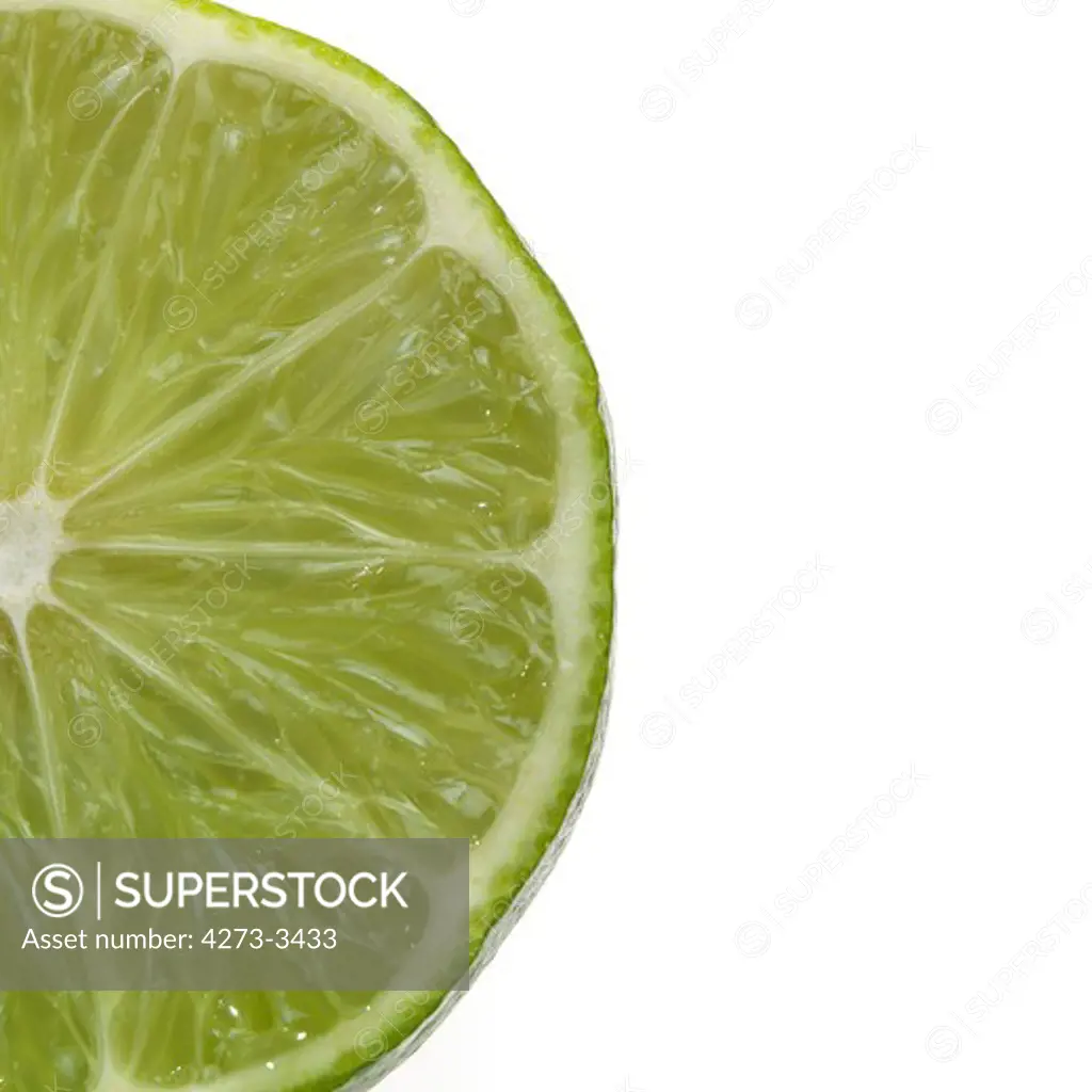 Green Lemon Citrus Aurantifolia Against White Background