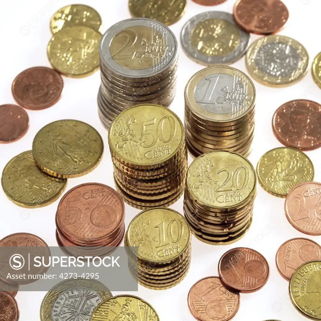Piles Of Euro Coins Against White Background