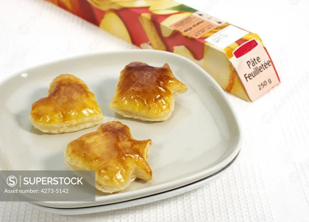 Crackers Made With Puff Or Flaky Pastry Against White Background