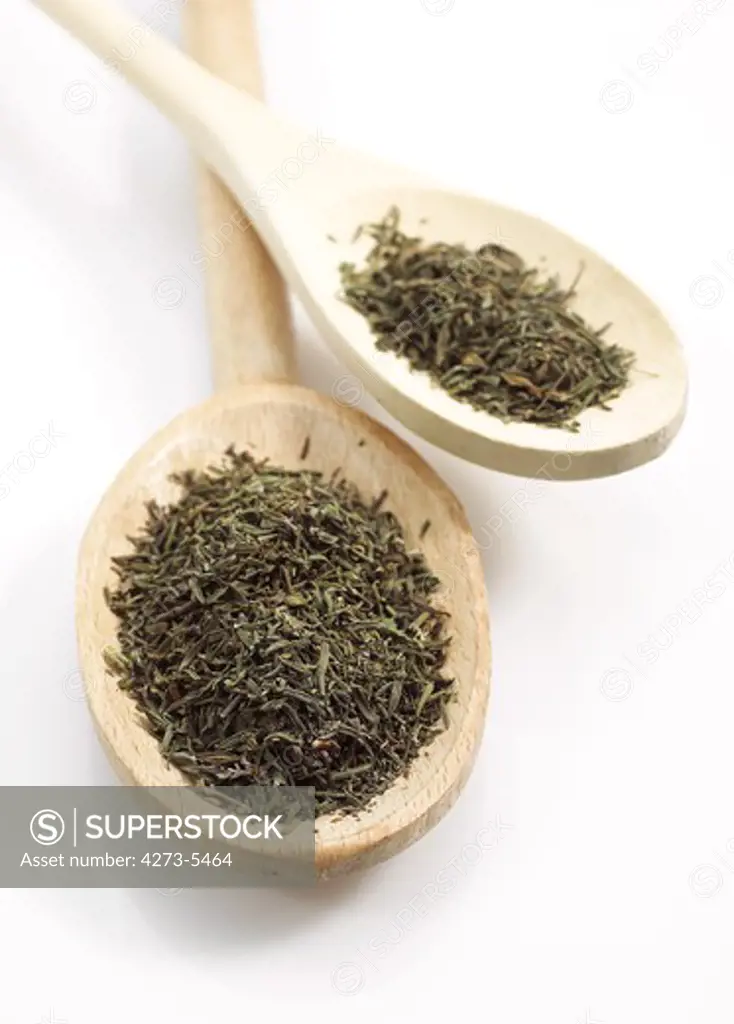 Provencial Thyme In Wooden Spoon Against White Background