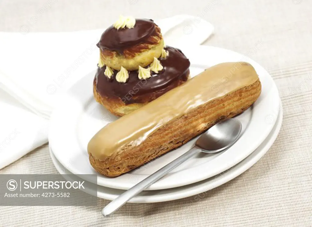 French Cakes Called Chocolate Religieuse And Coffe Eclair