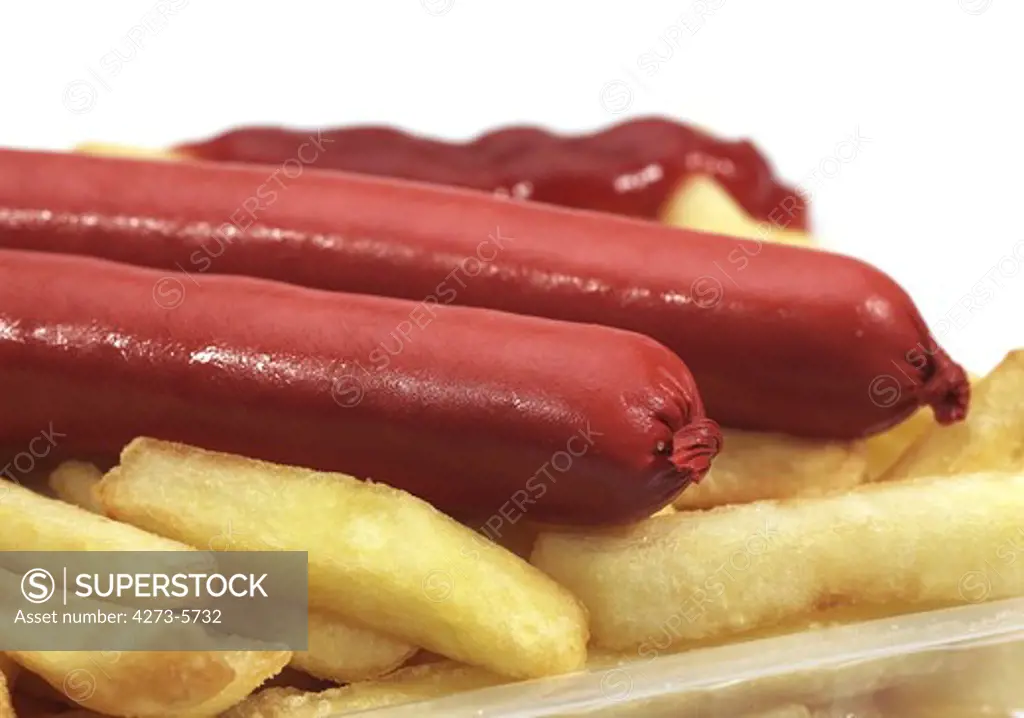 French Fries With Sausage And Ketchup Against White Background