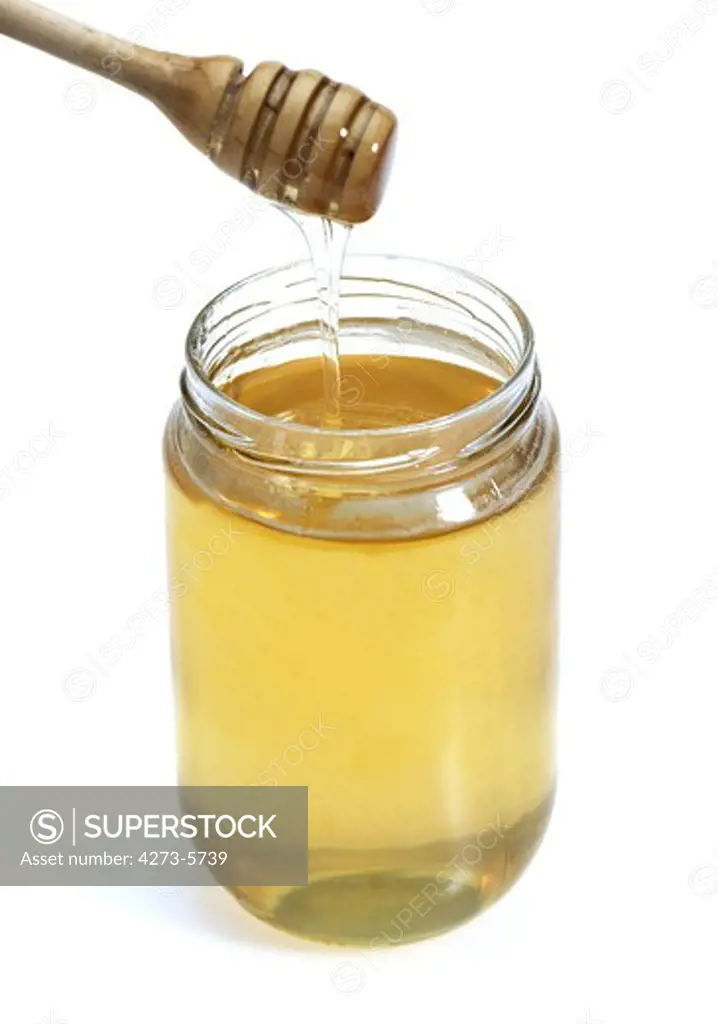 Pot Of Honey With Honey Spoon