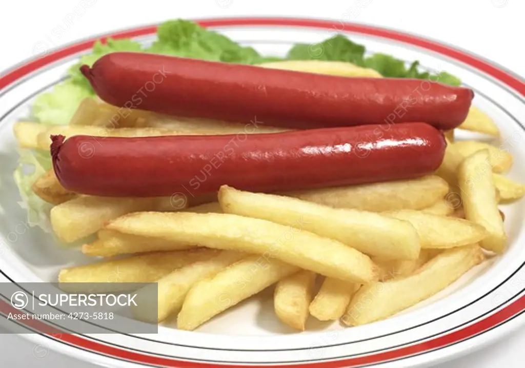 Plate With French Fries And Sausage Against White Background
