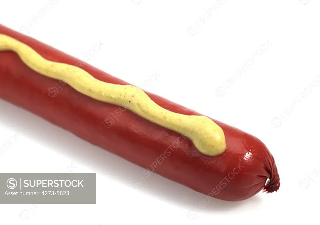 Sausage With Mustard Against White Background