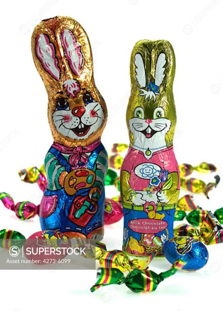 Chocolate Easter Rabbit And Eggs Against White Background